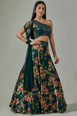 Shop beautiful teal printed satin lehenga online in USA with sequin blouse. Dazzle on weddings and special occasions with exquisite Indian designer dresses, sharara suits, Anarkali suits, wedding lehengas from Pure Elegance Indian fashion store in USA.-lehenga