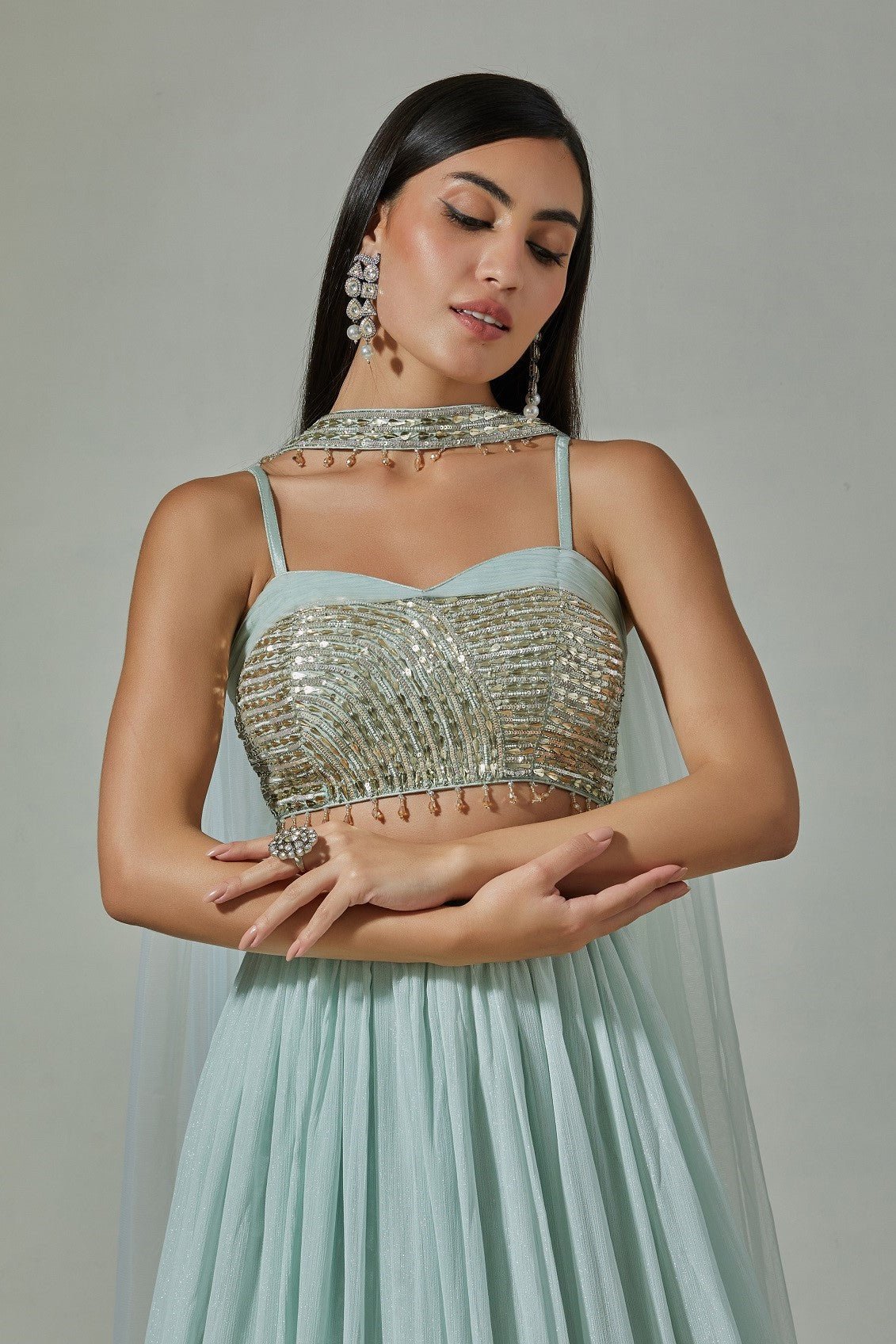Buy beautiful sky blue georgette lehenga online in USA with embroidered sequin blouse. Dazzle on weddings and special occasions with exquisite Indian designer dresses, sharara suits, Anarkali suits, wedding lehengas from Pure Elegance Indian fashion store in USA.-closeup