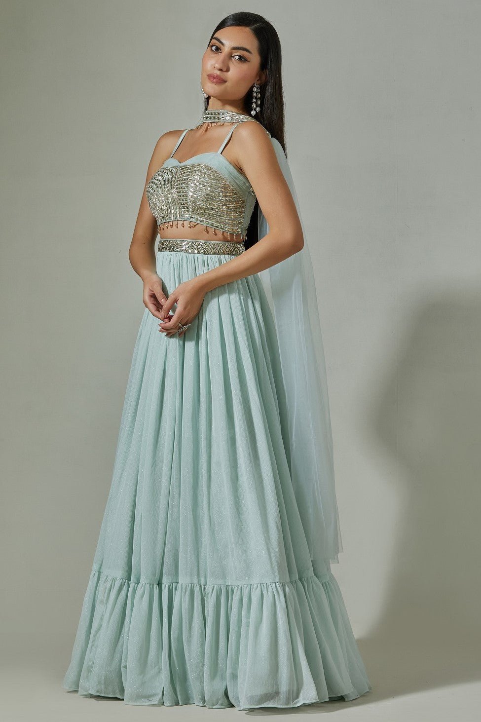 Buy beautiful sky blue georgette lehenga online in USA with embroidered sequin blouse. Dazzle on weddings and special occasions with exquisite Indian designer dresses, sharara suits, Anarkali suits, wedding lehengas from Pure Elegance Indian fashion store in USA.-left