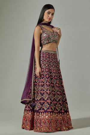Buy beautiful purple heavy embroidery lehenga online in USA with soft net dupatta. Dazzle on weddings and special occasions with exquisite Indian designer dresses, sharara suits, Anarkali suits, wedding lehengas from Pure Elegance Indian fashion store in USA.-side