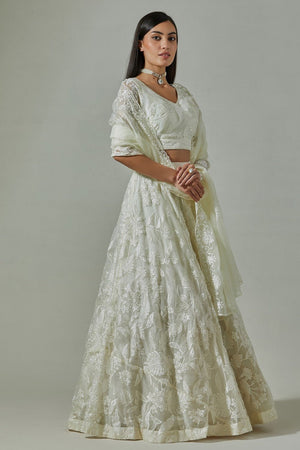 Buy beautiful ivory Parsi embroidery organza lehenga online in USA with soft net dupatta. Dazzle on weddings and special occasions with exquisite Indian designer dresses, sharara suits, Anarkali suits, wedding lehengas from Pure Elegance Indian fashion store in USA.-lehenga