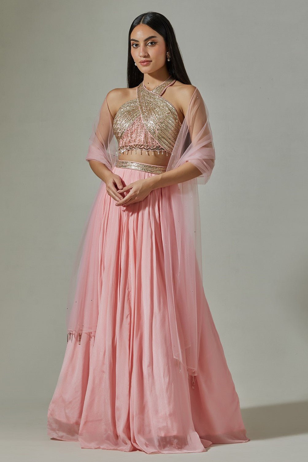 Shop beautiful baby pink cross halter chinon lehenga online in USA with pearl and mirror work. Dazzle on weddings and special occasions with exquisite Indian designer dresses, sharara suits, Anarkali suits, wedding lehengas from Pure Elegance Indian fashion store in USA.-full view