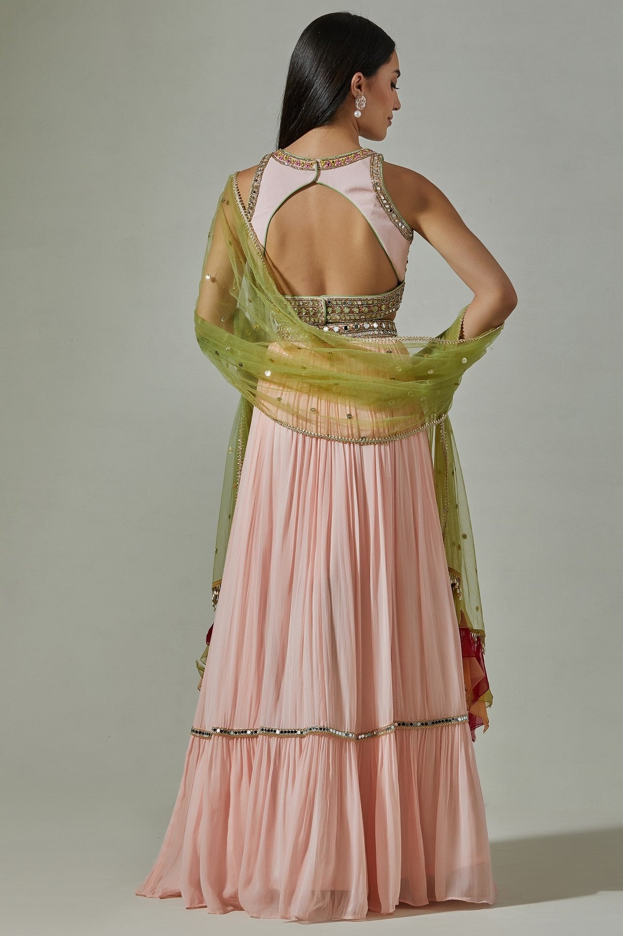 Shop beautiful pink embroidered georgette lehenga online in USA with green dupatta. Dazzle on weddings and special occasions with exquisite Indian designer dresses, sharara suits, Anarkali suits, wedding lehengas from Pure Elegance Indian fashion store in USA.-back