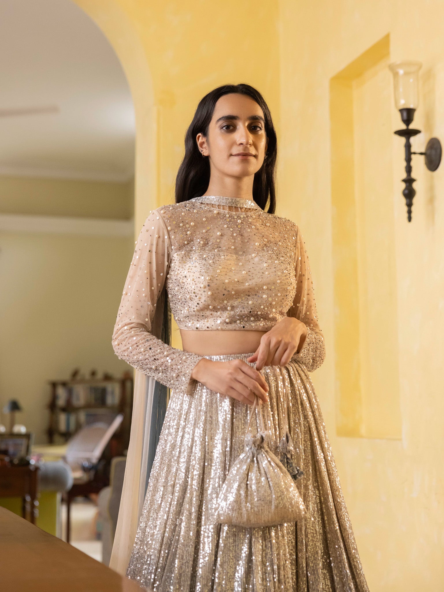 Shop this beautiful brown shimmery lehenga with a boat cut blouse and sheer long sleeves Dazzle on weddings and special occasions with exquisite Indian designer dresses, sharara suits, Anarkali suits, bridal lehengas, sharara suits from Pure Elegance Indian clothing store in USA.