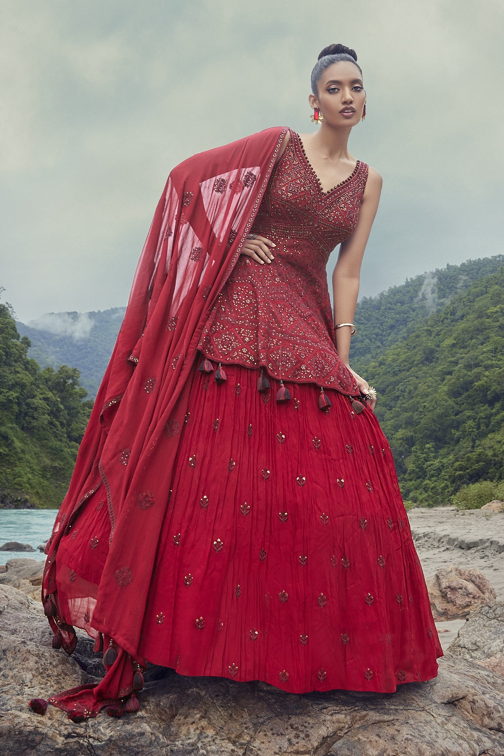 Shop this beautiful red lehenga with embroidered peplum choli. The lehenga is perfect for weddings and sangeet parties. Shop online from Pure Elegance