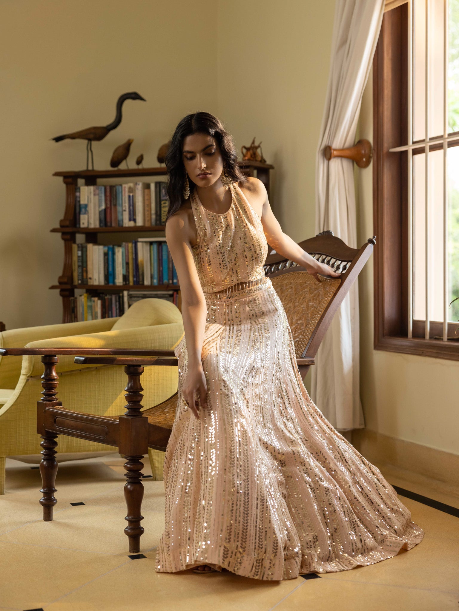 Shop look your best on wedding occasions in this beautiful nude color lehenga with mirror embroidery and a backless blouse. Dazzle on weddings and special occasions with exquisite Indian designer dresses, sharara suits, Anarkali suits, bridal lehengas, sharara suits from Pure Elegance Indian clothing store in the USA. Shop online from Pure Elegance.