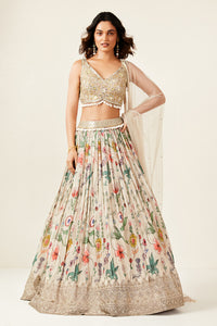 Shop look your best on wedding occasions in this beautiful grey color lehenga with mirror embroidery, cut dana, shells & coins detailing, and a beautiful blouse. Dazzle on weddings and special occasions with exquisite Indian designer dresses, sharara suits, Anarkali suits, bridal lehengas, and sharara suits from Pure Elegance Indian clothing store in the USA. Shop online from Pure Elegance.