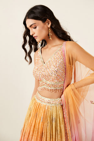 Shop look your best on wedding occasions in this beautiful pink color lehenga with resham and mirror embroidery, cut dana, and a beautiful blouse. Dazzle on weddings and special occasions with exquisite Indian designer dresses, sharara suits, Anarkali suits, bridal lehengas, and sharara suits from Pure Elegance Indian clothing store in the USA. Shop online from Pure Elegance.