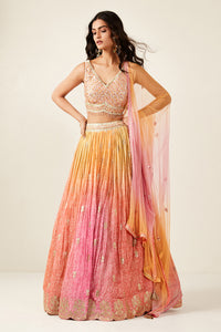 Shop look your best on wedding occasions in this beautiful pink color lehenga with resham and mirror embroidery, cut dana, and a beautiful blouse. Dazzle on weddings and special occasions with exquisite Indian designer dresses, sharara suits, Anarkali suits, bridal lehengas, and sharara suits from Pure Elegance Indian clothing store in the USA. Shop online from Pure Elegance.