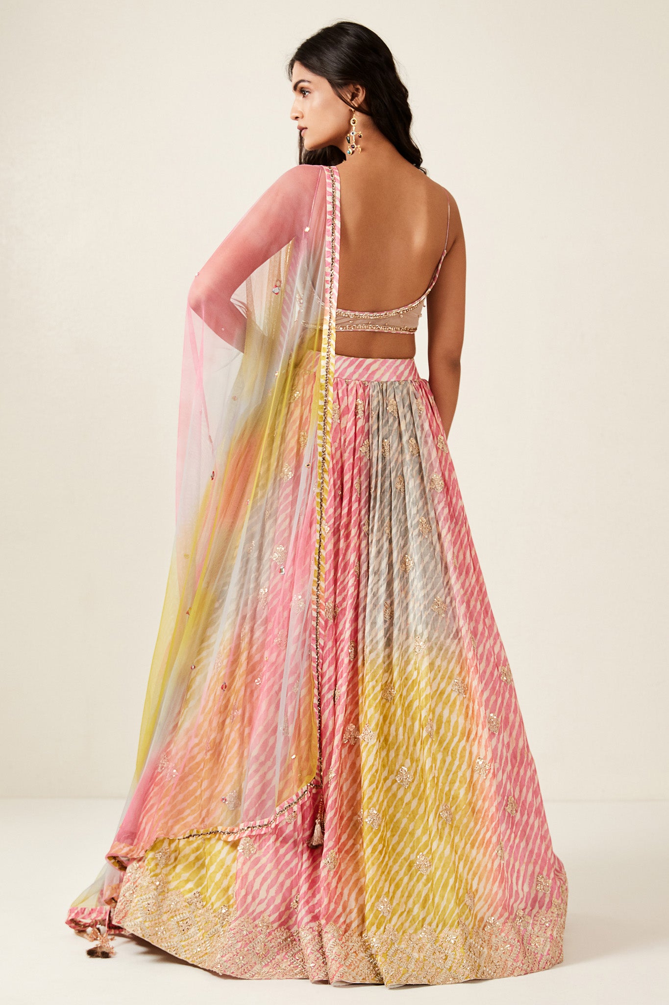 Shop look your best on wedding occasions in this beautiful multi-color lehenga with france cut and mirror embroidery, cut dana, and a beautiful blouse. Dazzle on weddings and special occasions with exquisite Indian designer dresses, sharara suits, Anarkali suits, bridal lehengas, and sharara suits from Pure Elegance Indian clothing store in the USA. Shop online from Pure Elegance.