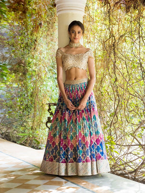 Buy stunning multicolor lehenga online in USA with off-shoulder blouse. Dazzle on weddings and special occasions with exquisite Indian designer dresses, sharara suits, Anarkali suits, wedding lehengas from Pure Elegance Indian fashion store in USA.-front