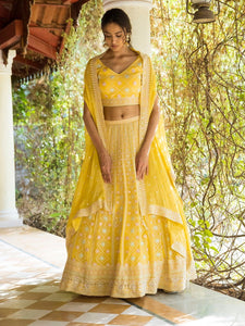 Buy beautiful sunny yellow Lucknowi work lehenga online in USA with dupatta. Dazzle on weddings and special occasions with exquisite Indian designer dresses, sharara suits, Anarkali suits, wedding lehengas from Pure Elegance Indian fashion store in USA.-full view