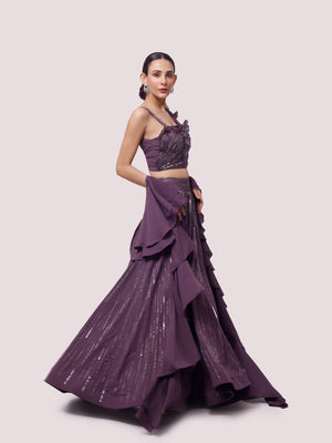 Buy a Beautiful purple georgette sleeveless lehenga featuring pearl, cut dana, and sequin work. The lehenga is perfect for weddings and sangeet parties. Shop online from Pure Elegance.