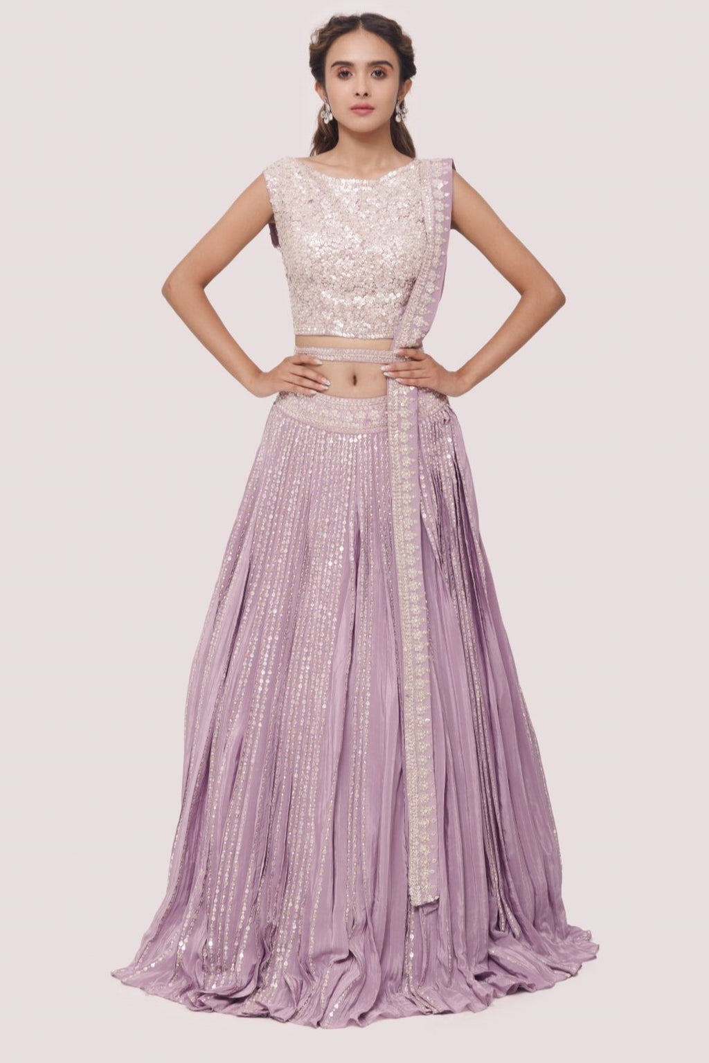 Shop the Look your best on wedding occasions in this lavender color lehenga with sequin and tikki work and a beautiful dupatta. Dazzle on weddings and special occasions with exquisite Indian designer dresses, sharara suits, Anarkali suits, bridal lehengas, and sharara suits from Pure Elegance Indian clothing store in the USA. Shop online from Pure Elegance.