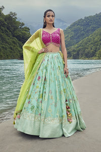 Shop this beautiful blue lehenga with an embellished green mint dupatta. The lehenga is perfect for sangeet parties. It is crafted with intricate embroidery work. Shop online from Pure Elegance.