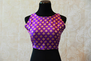 Shop this ethnic Indian purple designer blouse from Pure Elegance online or from our store in USA. Buta printed pre-stitched saree blouse ideal for any reception. Front View.