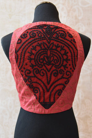 Shop this traditional Indian designer crop top style sleeveless blouse from Pure Elegance online or from our store in USA. Perfect for any wedding or reception. Red Patch.