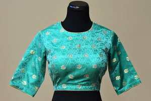 Shop this ethnic Indian tanchoi silk designer blouse with gold trim online or from our Pure Elegance store in USA. It is perfect for any wedding or reception. Green Blouse.