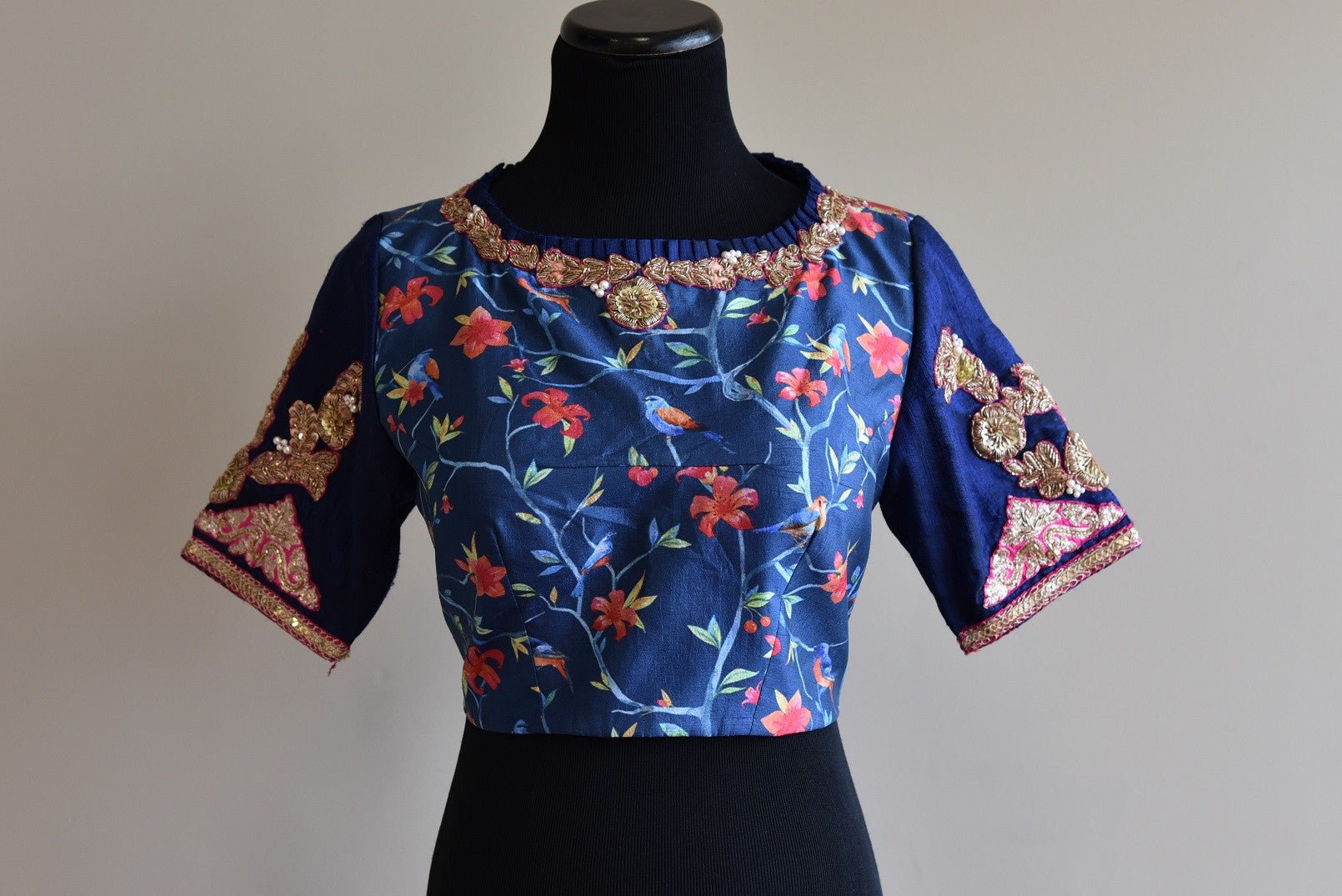 Shop this ethnic Indian designer silk blouse with floral print online or from our Pure Elegance store in USA. It is perfect for any wedding or reception party. Blue and Golden.