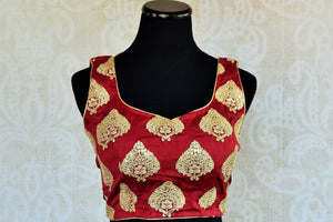 Buy this Indian traditional matka silik designer blouse online as well as at our shop in Edison. Sleeveless low neck maroon blouse perfect for any wedding or prom. Front View.
