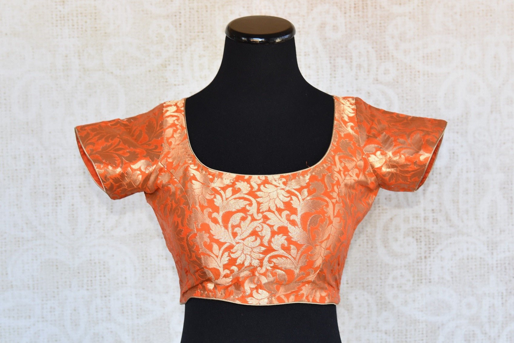 Buy this orange semi-sleeved ethnic pre-stitched designer crop top blouse perfect for any wedding or pooja from Pure Elegance online or from our store near NYC. Front View.