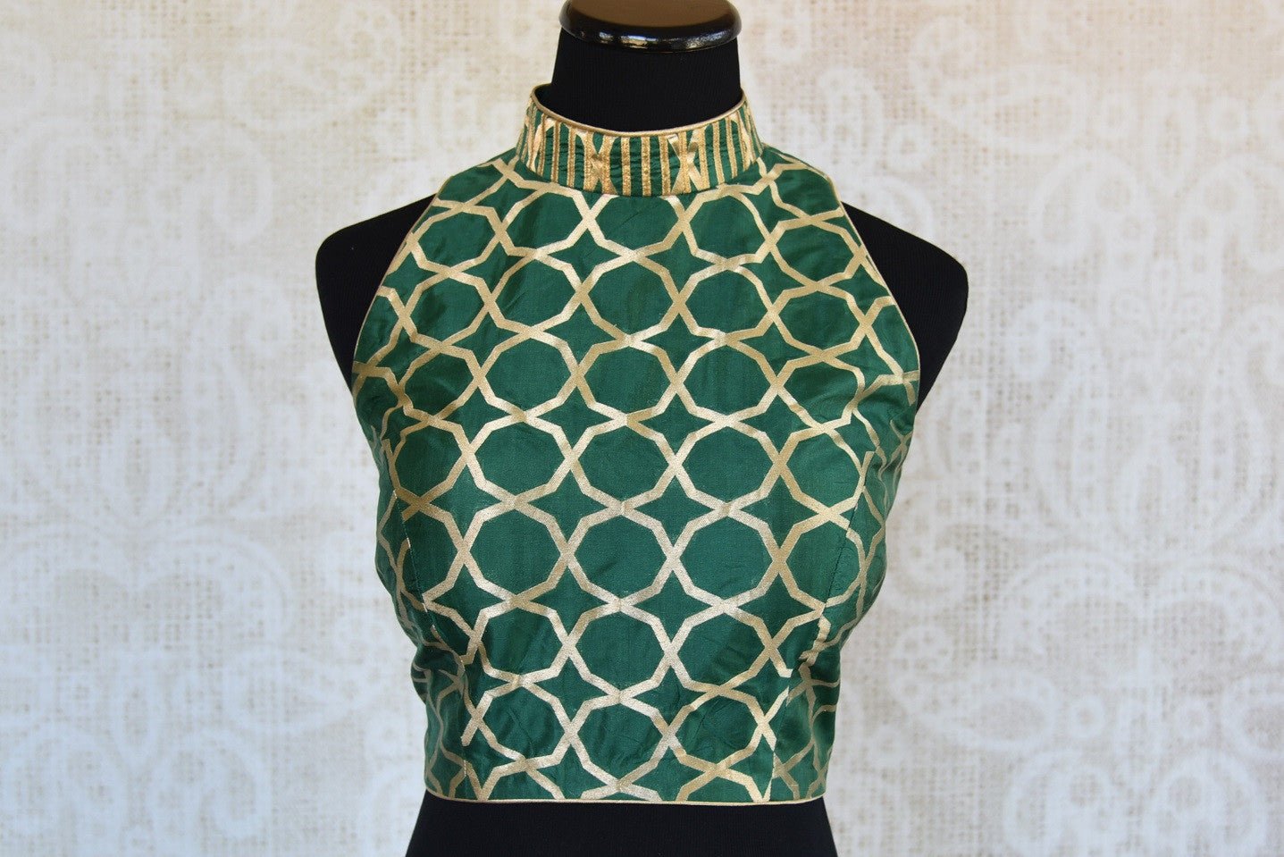 Shop this traditional Indian benarasi halter neck sleeveless designer blouse perfect for any wedding or reception online or from our Pure Elegance store in USA.  Front View.
