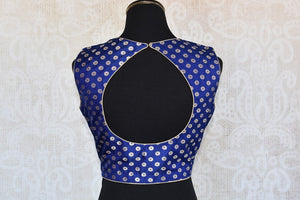 Buy this Indian traditional sleeveless banarasi navy blue blouse from Pure Elegance online or from our store in USA. Perfect for any wedding or reception party. Back Slit.