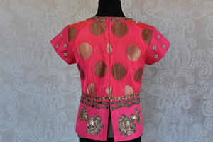 Shop this traditional Indian pink embroidered banarasi blouse from Pure Elegance online or from our store in Edison near NJ. Ideal for any wedding or sangeet. Top View.