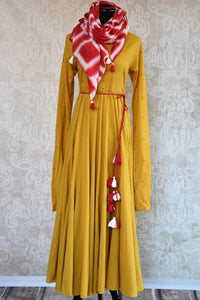 Buy this malmal cotton mustard yellow anarkali dress online or from our store in USA. The Indian outfit with a French knot is ideal for any wedding or reception. Front View.