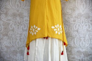 Buy this mustard Indo western yellow and white Indian ethnic dress online from our Pure Elegance store in USA. It is perfect for any wedding or reception party. White and Yellow.