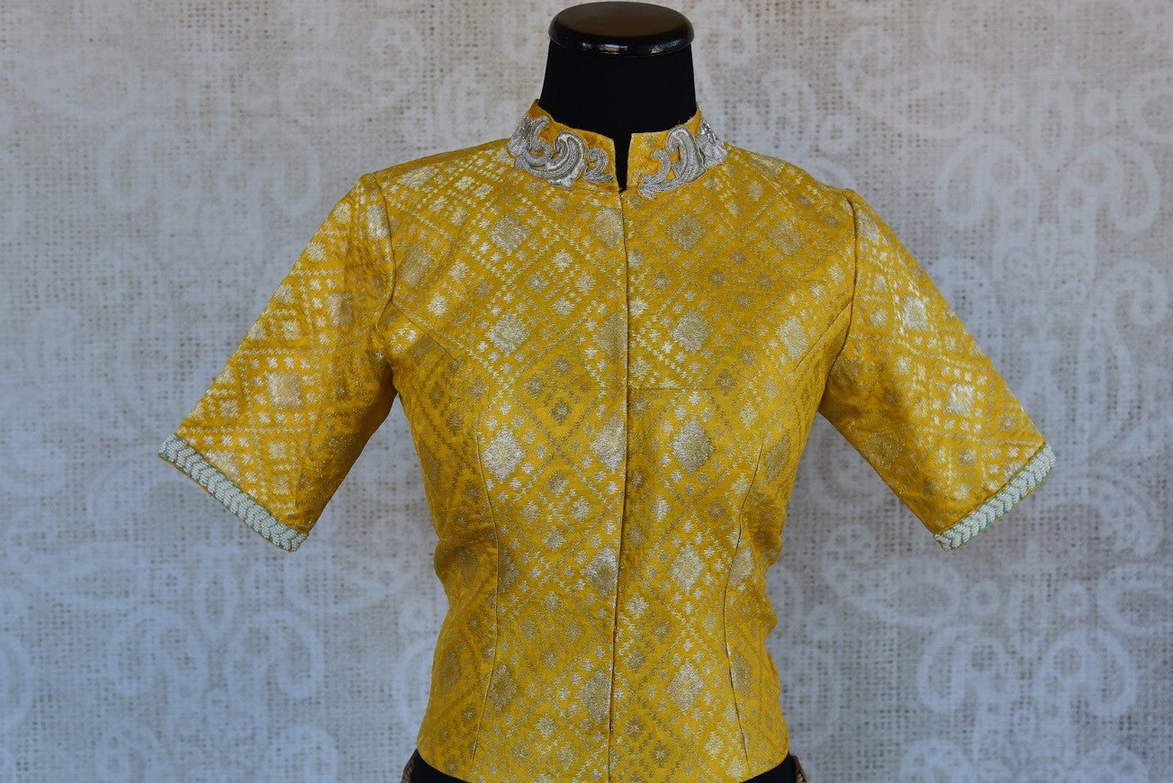 Buy this Indian traditional yellow silk embroidered designer banarasi blouse ideal for any puja or baby shower from Pure Elegance online or at our store in USA. Front View.