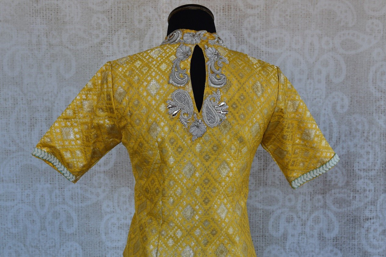 Buy this Indian traditional yellow silk embroidered designer banarasi blouse ideal for any puja or baby shower from Pure Elegance online or at our store in USA. Back View.
