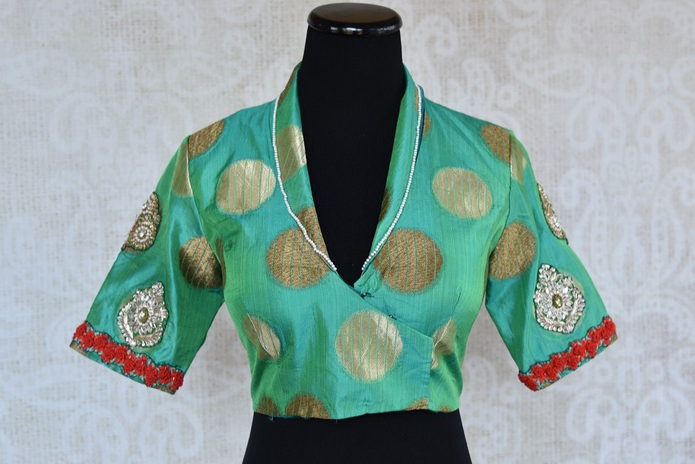 Buy this Indian traditional embroidered high neck designer blouse from Pure Elegance online or from our store near NYC. Ideal for any sangeet or reception party. Front View.