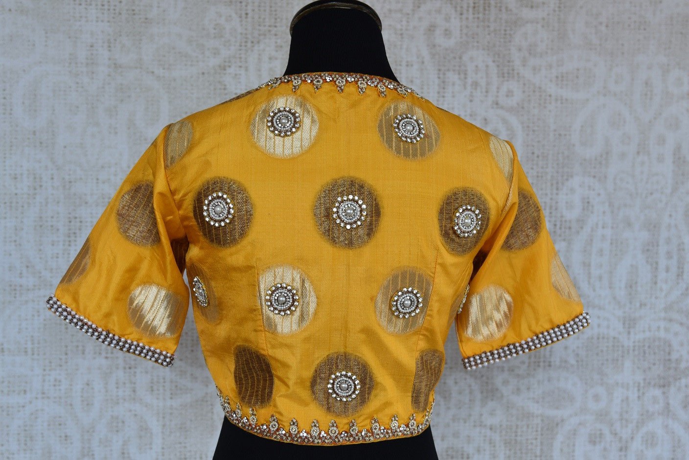 Buy this traditional Indian yellow banarasi designer blouse from Pure Elegance perfect for any sangeet party or puja available online or from our store in USA. Back View.
