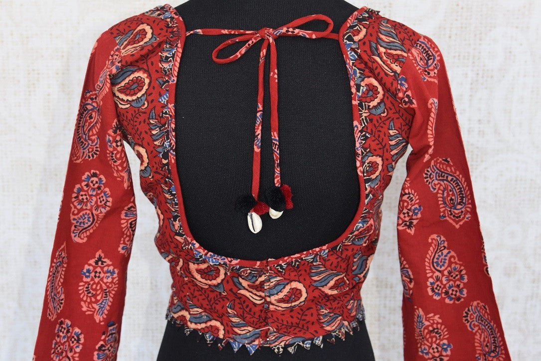 Buy this Indian traditional full sleeved red cotton print blouse from Pure Elegance online or from our store in USA. Perfect for any engagement or sangeet party. Back View.