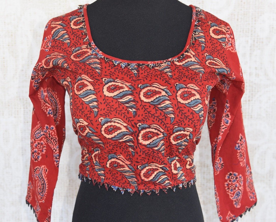 Buy this Indian traditional full sleeved red cotton print blouse from Pure Elegance online or from our store in USA. Perfect for any engagement or sangeet party. Front View.