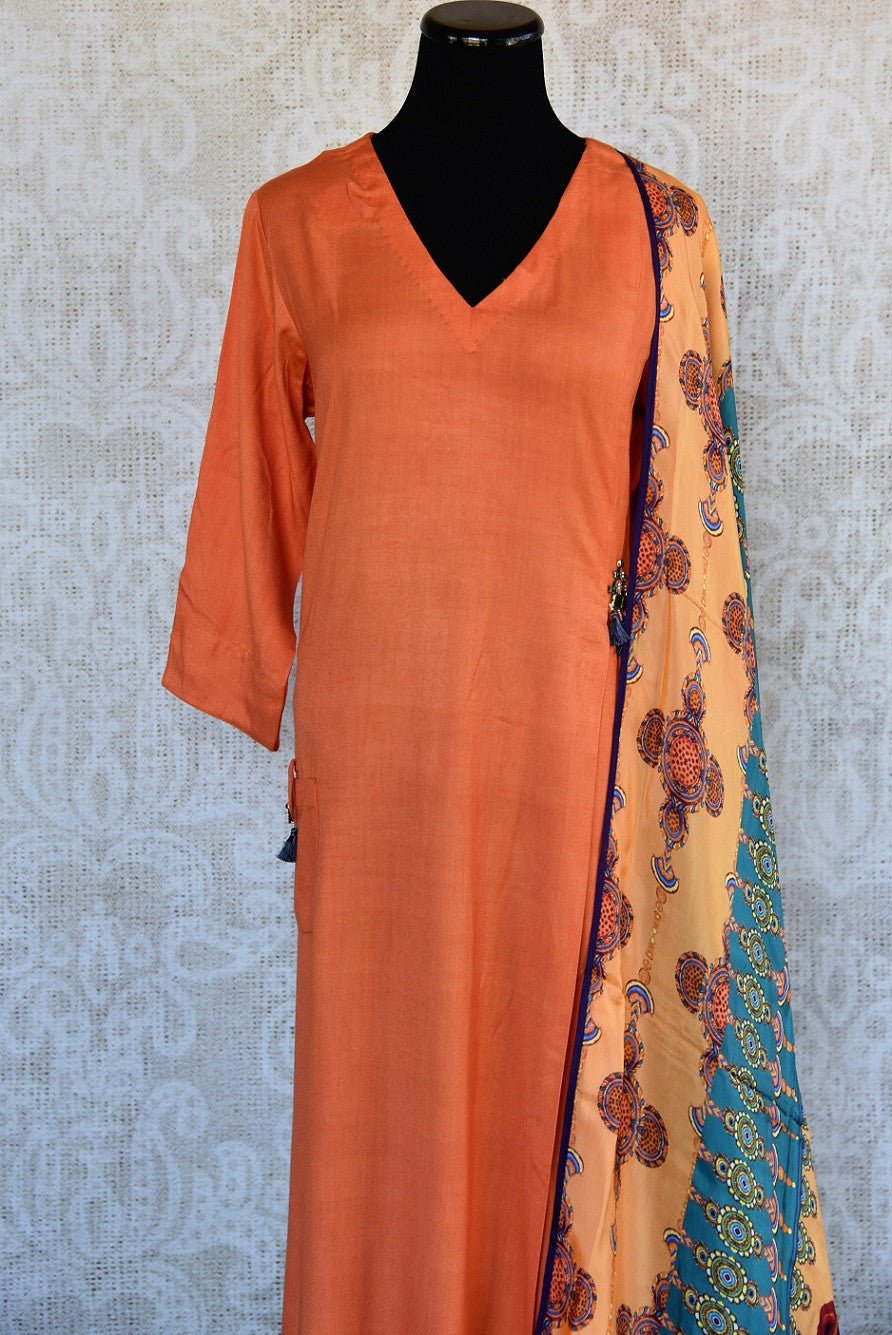 402023, Shop this Indian traditional orange cotton-silk dress from Pure Elegance with printed dupatta online or from our store in USA. Perfect for any wedding, reception or engagement. Top View.