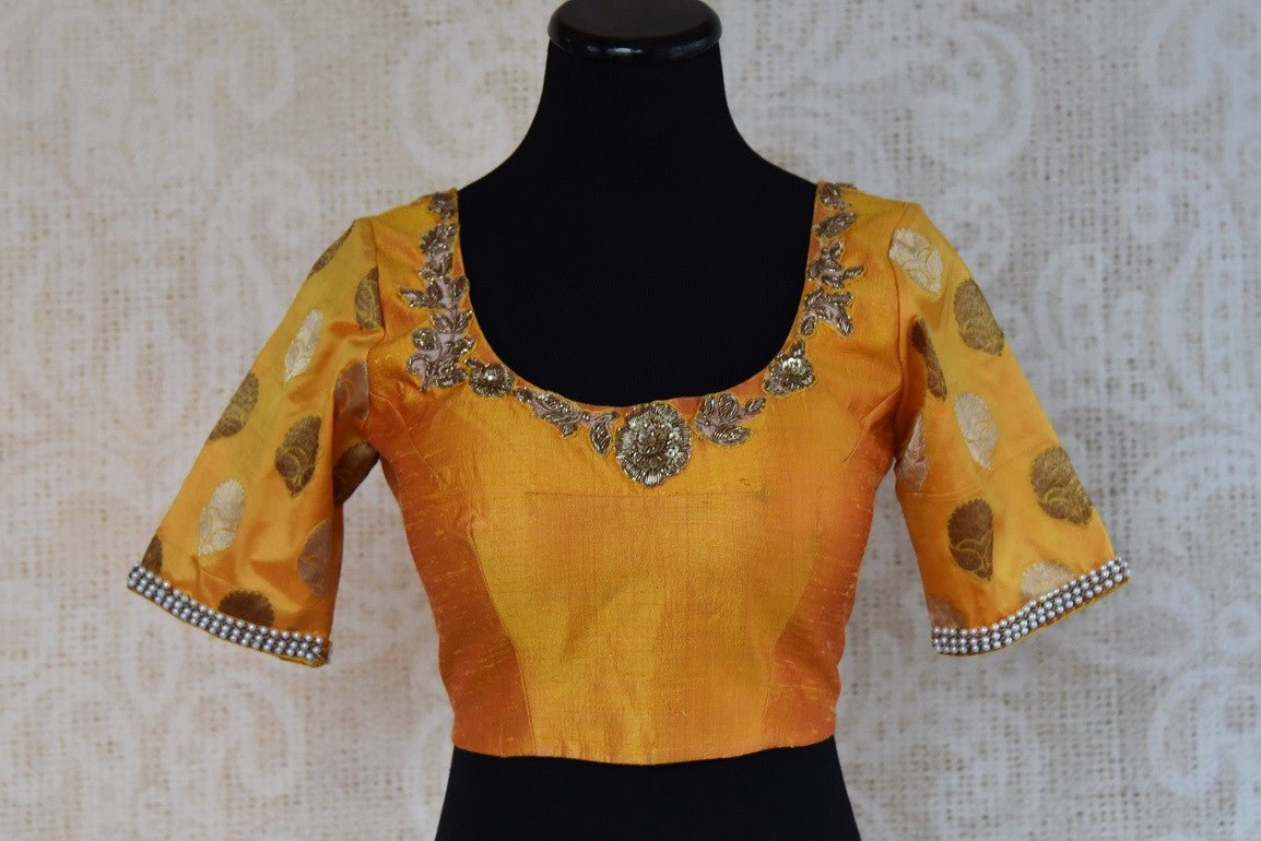 Shop this traditional Indian yellow silk designer blouse from Pure Elegance online or from our store in near NYC. It is perfect for any sangeet or prom party.  Front View.