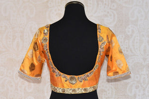 Shop this traditional Indian yellow silk designer blouse from Pure Elegance online or from our store in near NYC. It is perfect for any sangeet or prom party. Back View.