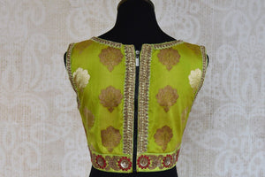 Shop this traditional Indian green banarasi embroidered blouse from Pure Elegance online or from our store in USA. Perfect for any wedding or reception party. Back View.