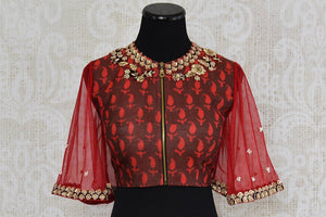 Red cotton silk blouse with net embroidered bell sleeves and front zipper. Perfect to pair with saree.-front