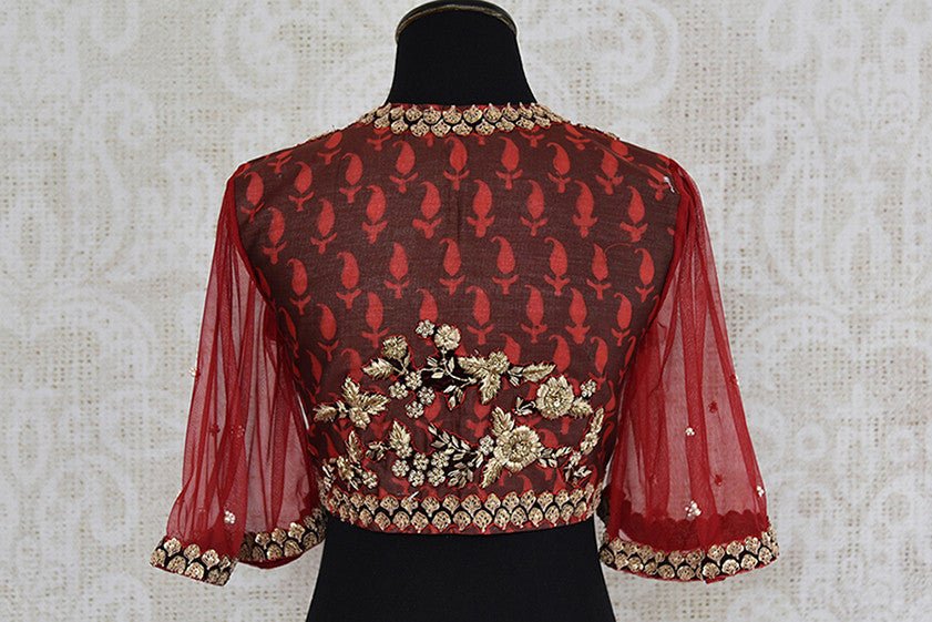 Red cotton silk blouse with net embroidered bell sleeves and front zipper. Perfect to pair with saree.-back