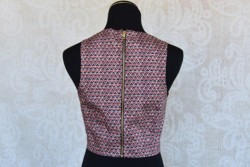 Modern look crop top style silk blouse with lovely geometric pattern. Pair this blouse with saree and Lehenga skirt.-Back Zipper