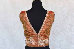 Orange ikkat printed pre-stitched blouse with zari embroidery V-neck blouse. Pair with solid saree and skirt.-back