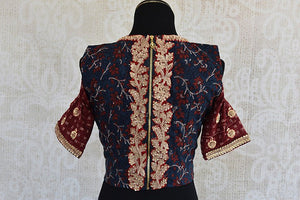 Really stylish designer cold shoulder zari embroidery blouse. Grab this Indian blouse to pair it with saree.-back