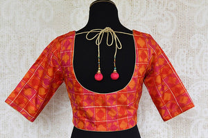 Orange silk ikkat blouse in choli design. Pair this traditional blouse with any saree or lahenga. -back