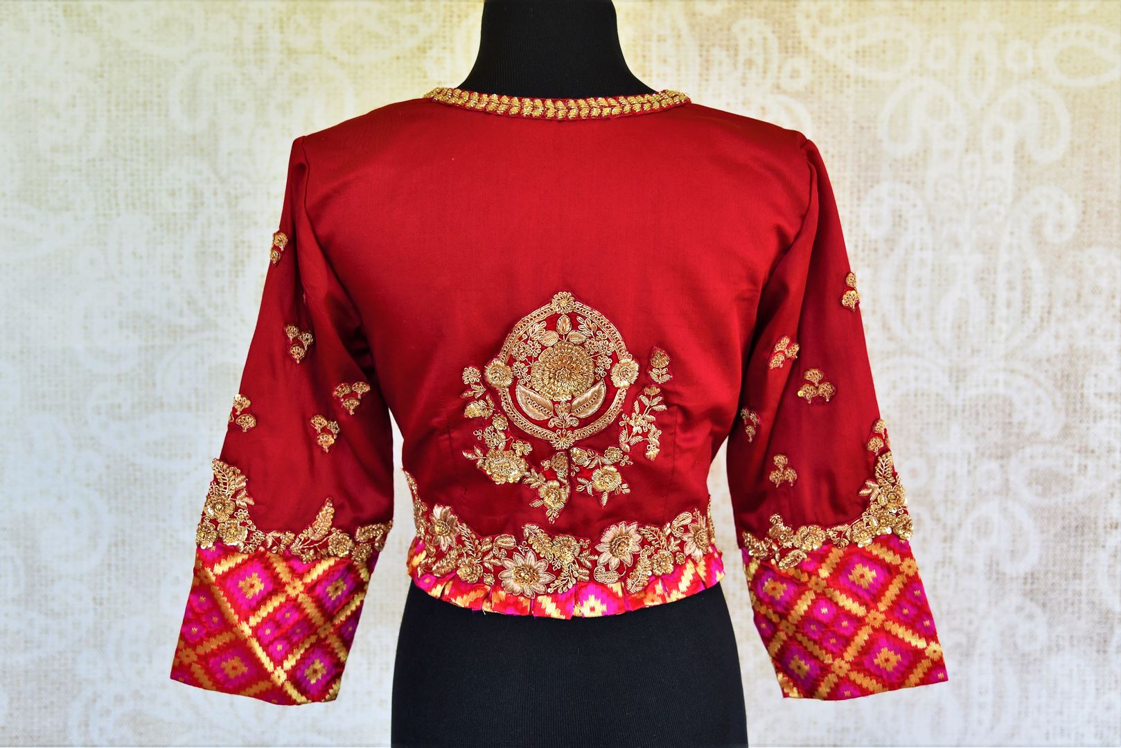 Buy beautiful red embroidered silk blouse online from Pure Elegance. Our Indian fashion store in USA brings a stunning range of readymade saree blouses for women.-back