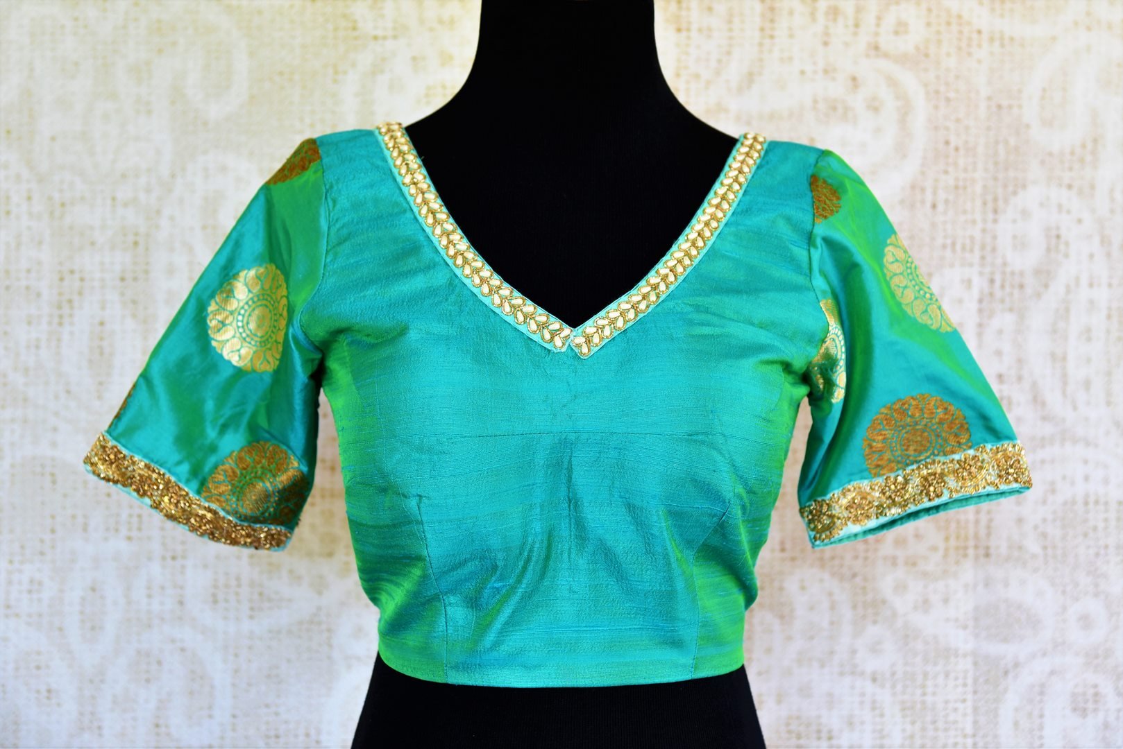 Buy green embroidered silk blouse online in USA with zari buta sleeves. Pure Elegance fashion store presents a range of ready-made designer sari blouses in USA.-front
