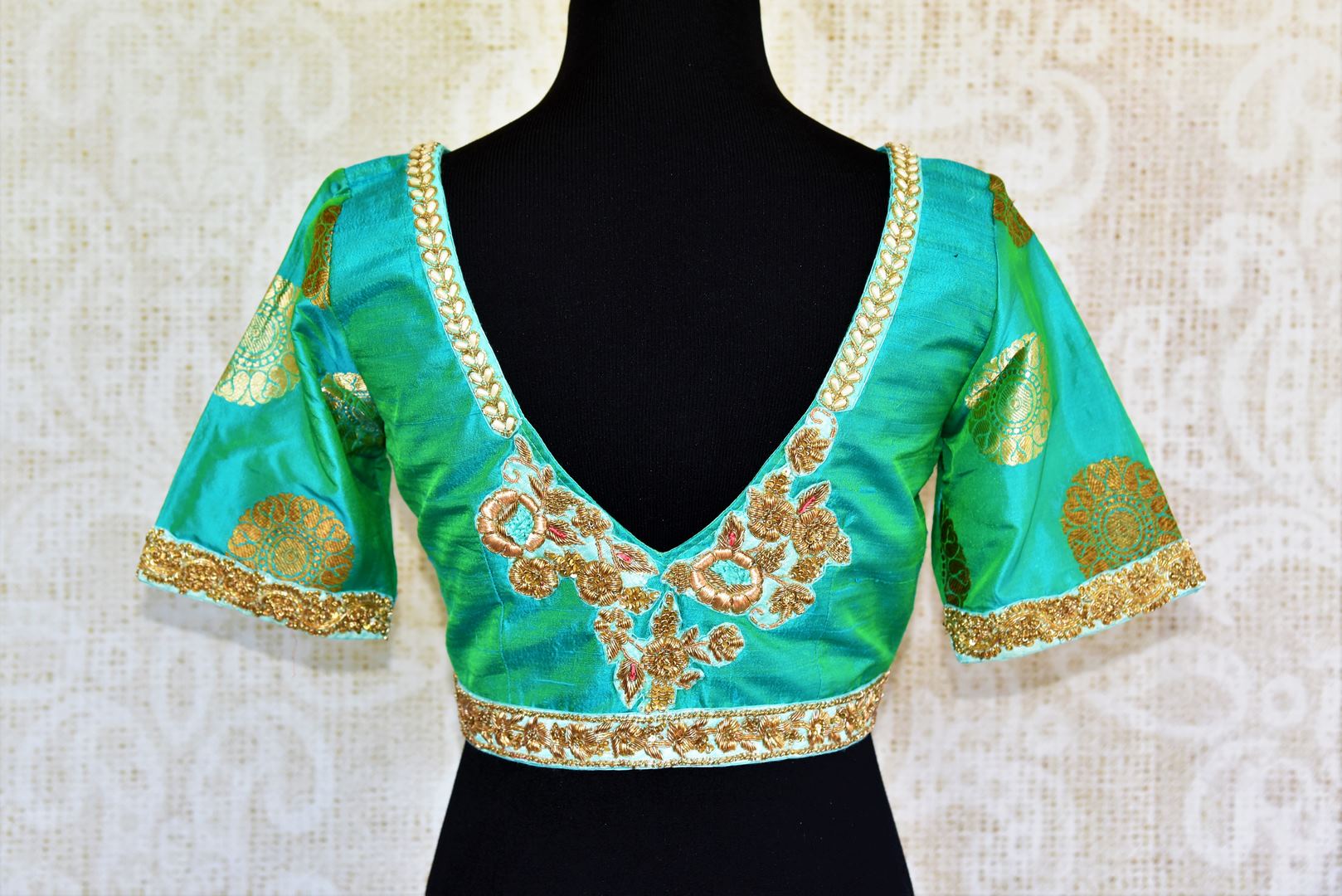 Buy green embroidered silk blouse online in USA with zari buta sleeves. Pure Elegance fashion store presents a range of ready-made designer sari blouses in USA.-back