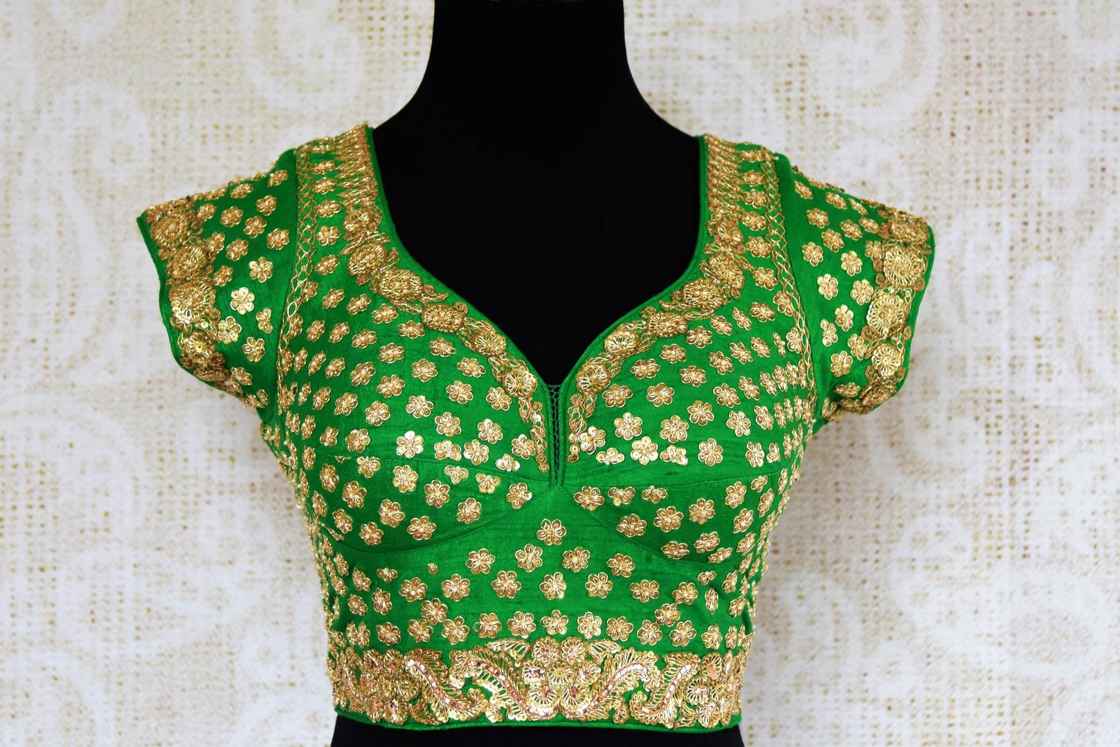 Green silk embroidered saree blouse for online shopping in USA. Pure Elegance clothing store brings an exquisite range of Indian readymade saree blouses in USA for women.-front